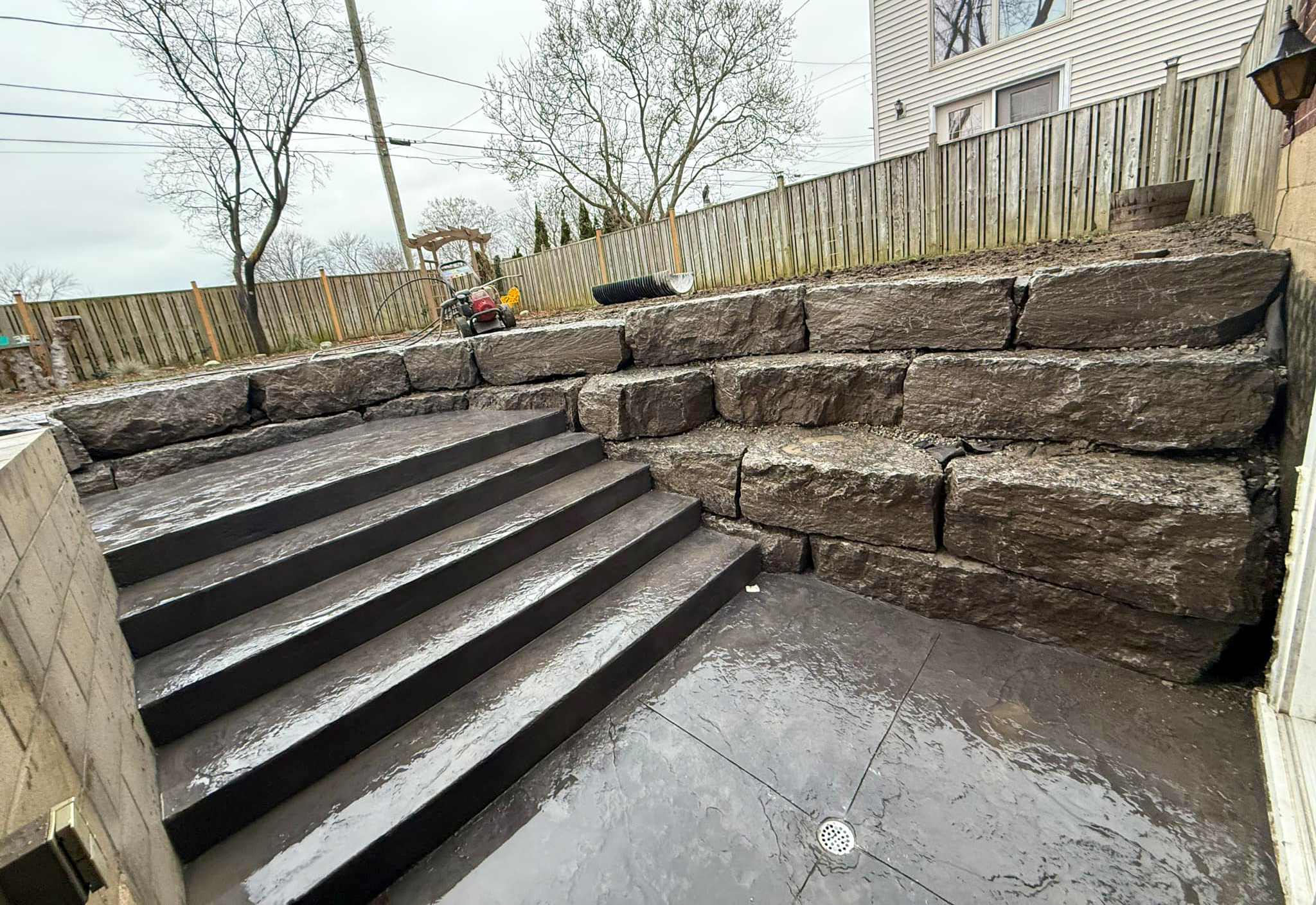 Discover how our Windsor excavation team expertly installed massive armour stones using custom solutions and specialized equipment to create a stunning, natural landscape feature.