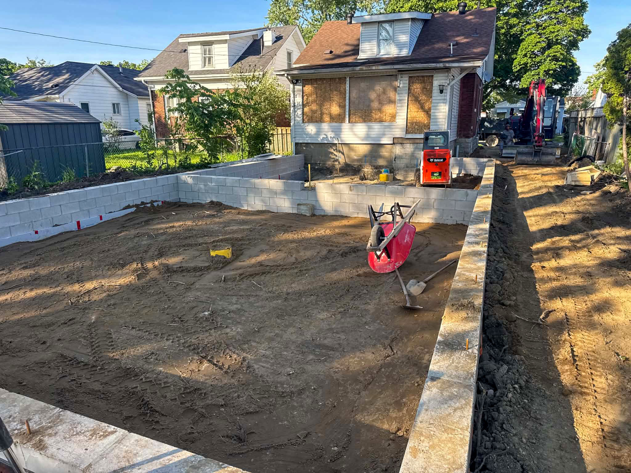 Block foundation walls ready for backfill on a home addition