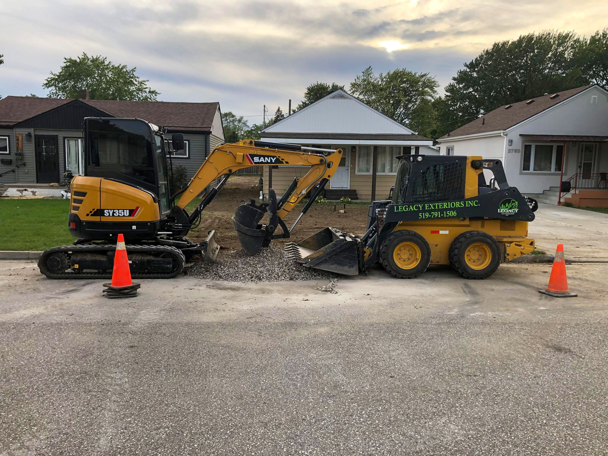 Two of our excavators at Legacy Exteriors Inc